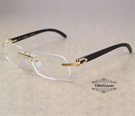 rimless buffalo horn glasses.